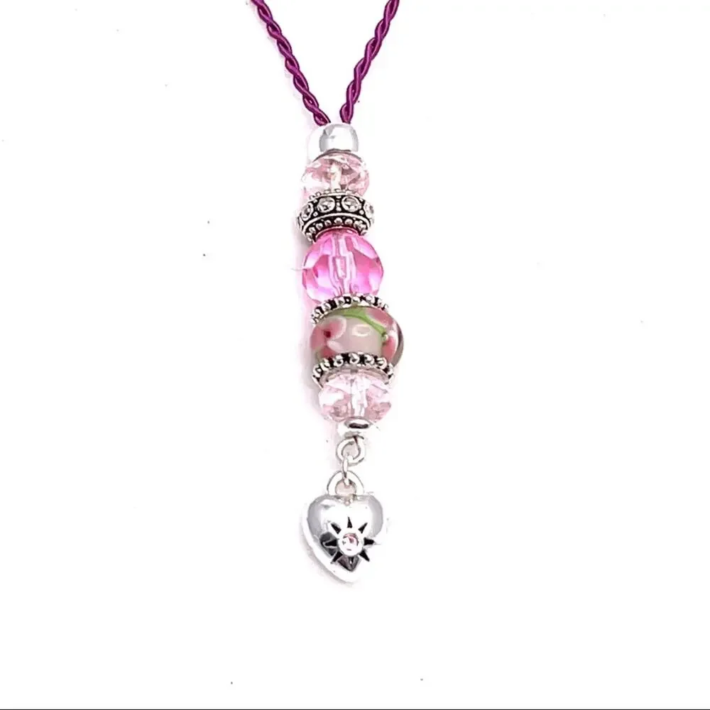 Necklace with heart charm and beads in pink and silver